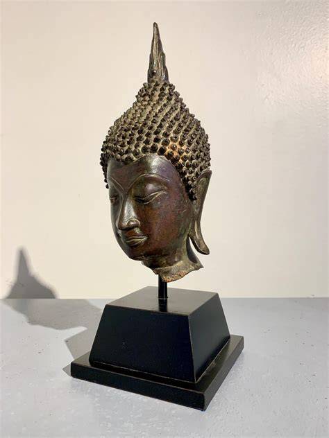 bronze tibetan buddha head iconography